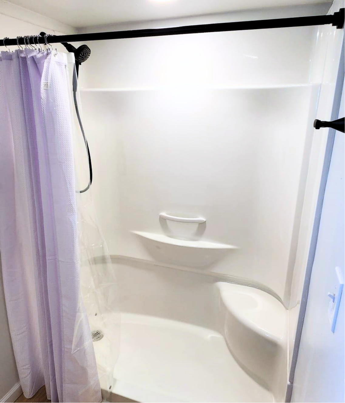 Expanded bathroom with new walk-in shower after closet removal — after Wahl remodel